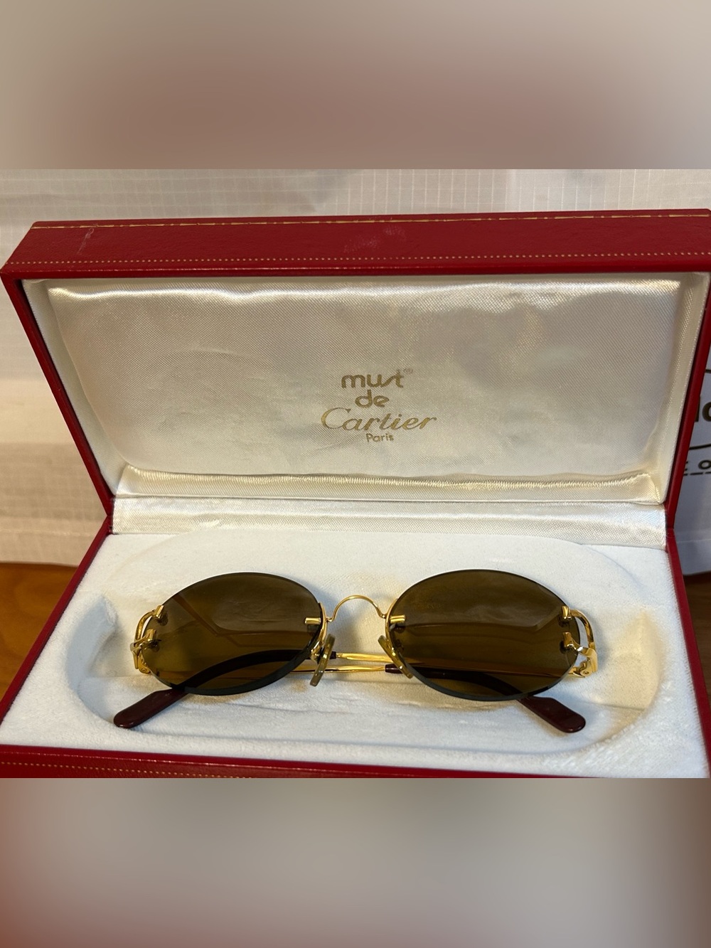 Cartier Gold Rim Oval Sunglasses with Brown Lenses